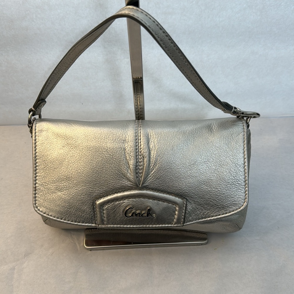 Coach metallic silver clutch bag with wristband in excellent preowned condition